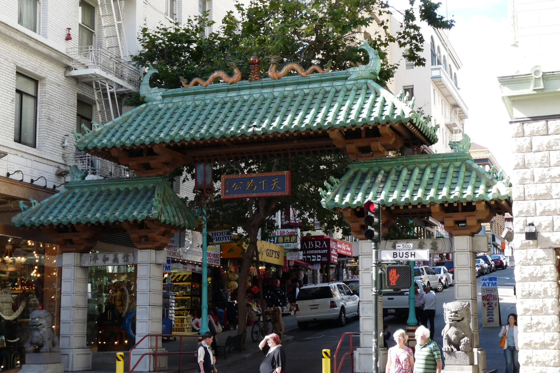 Ornate Dragon Gate, with gold dragons on its green-tiled roof. It’s the main entrance to Chinatown, San Francisco.
