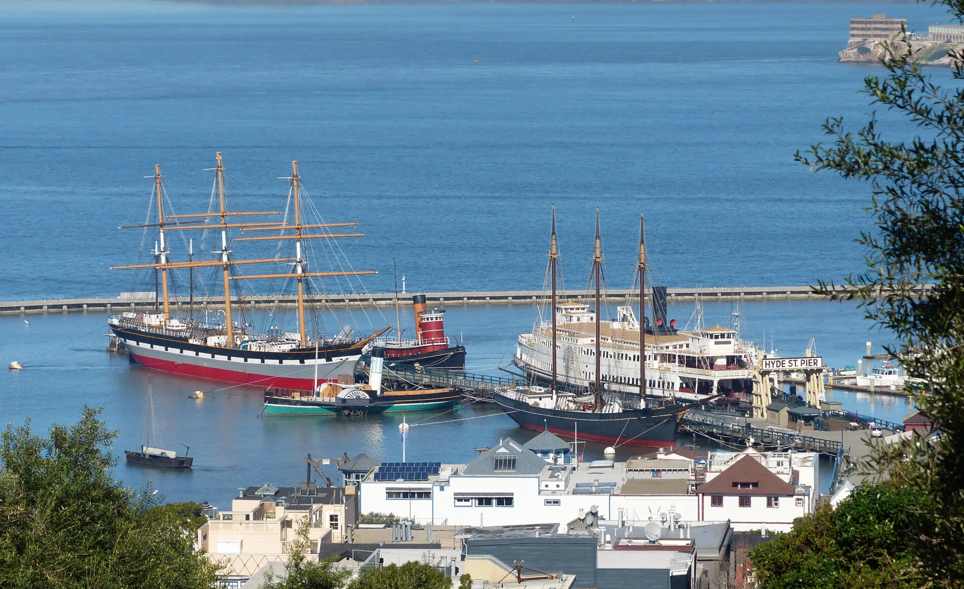 The Hyde Street Pier Museum collection of historic vessels including a 1903 three-masted schooner and an 1886 square-rigger.