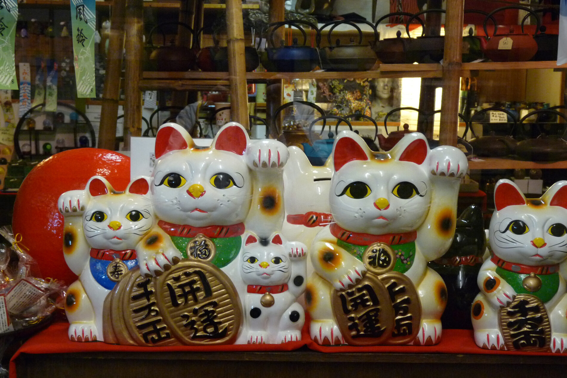 Shelf of Maneki-nekos (beckoning cats) in a San Francisco Japantown shop.