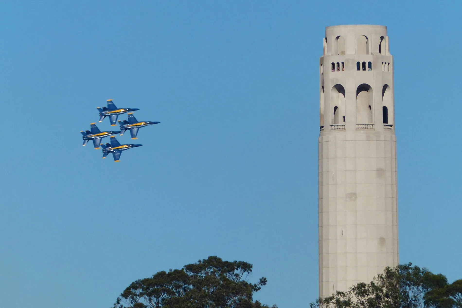 The U.S. Navy’s Blue Angels fly by Coit Tower during a San Francisco Fleet Week Air Show.