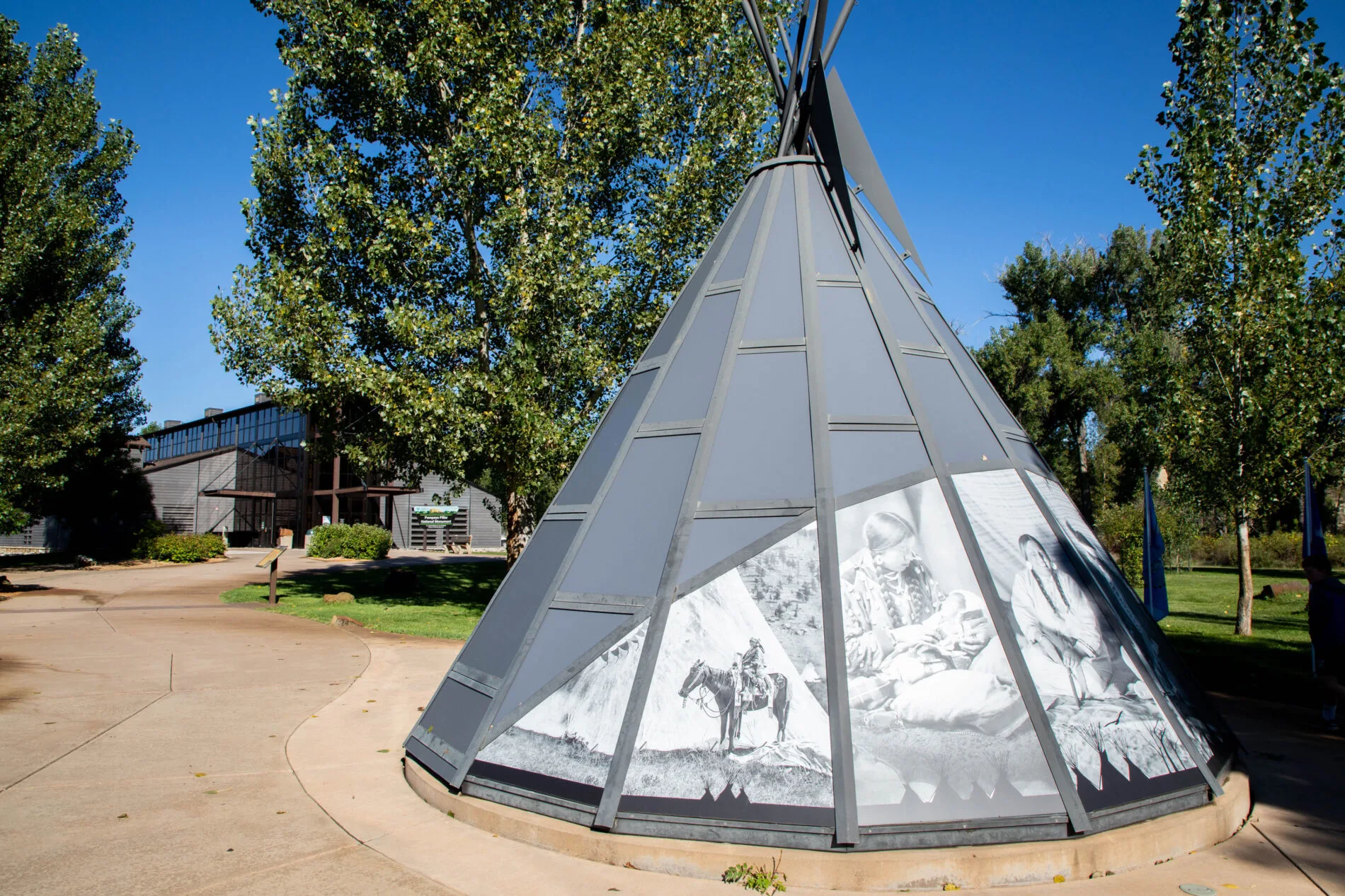 Glass teepee with photos of Native Americans.