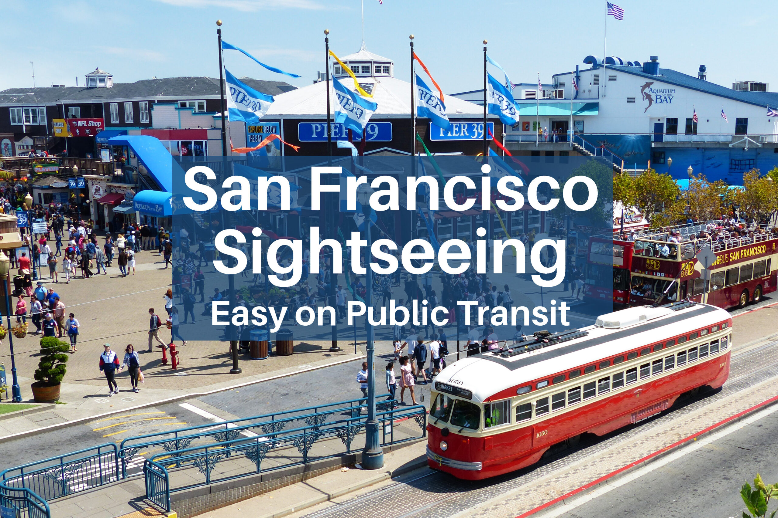 A bright red historic street car arrives at Pier 39 in San Francisco.