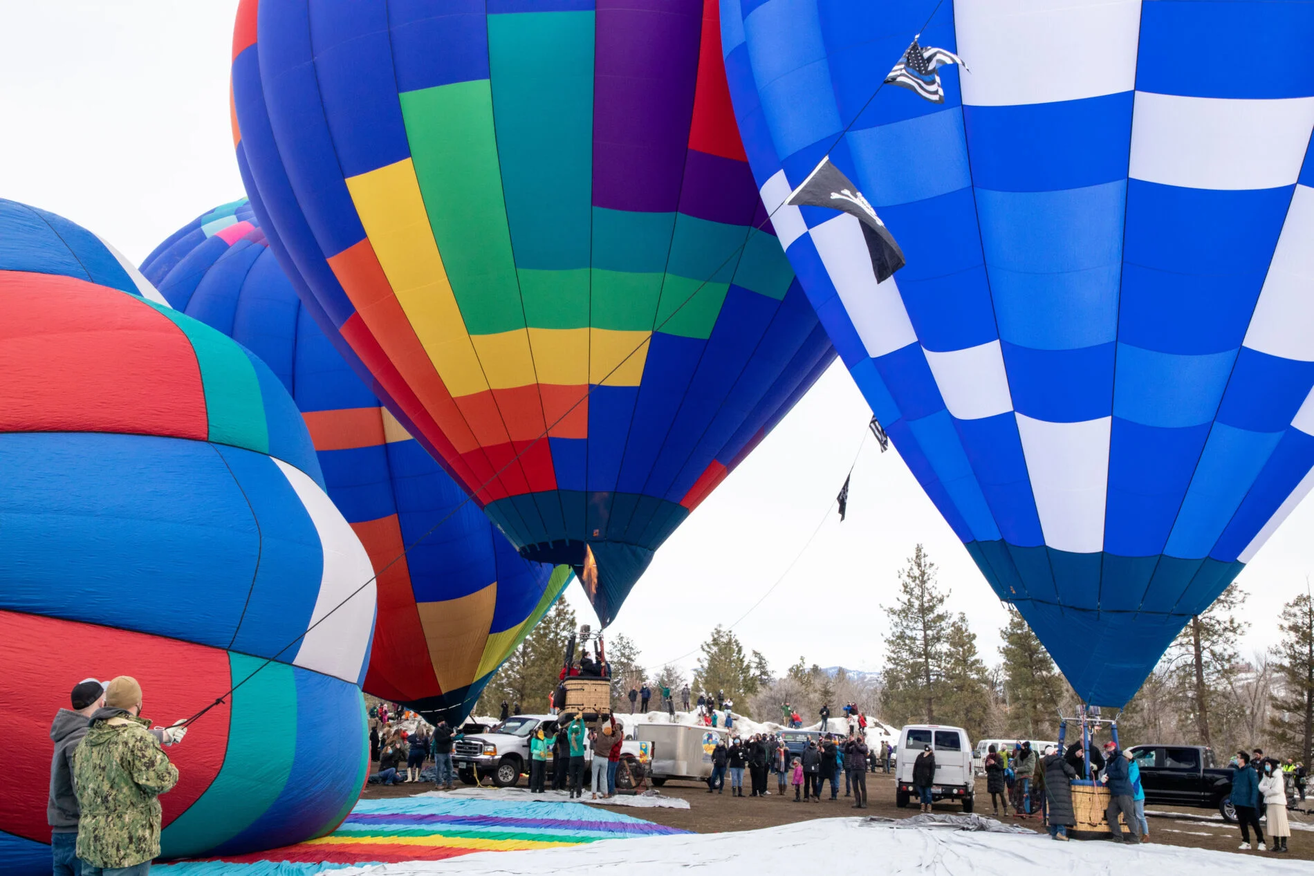 People watch in awe at the winter balloon festival.