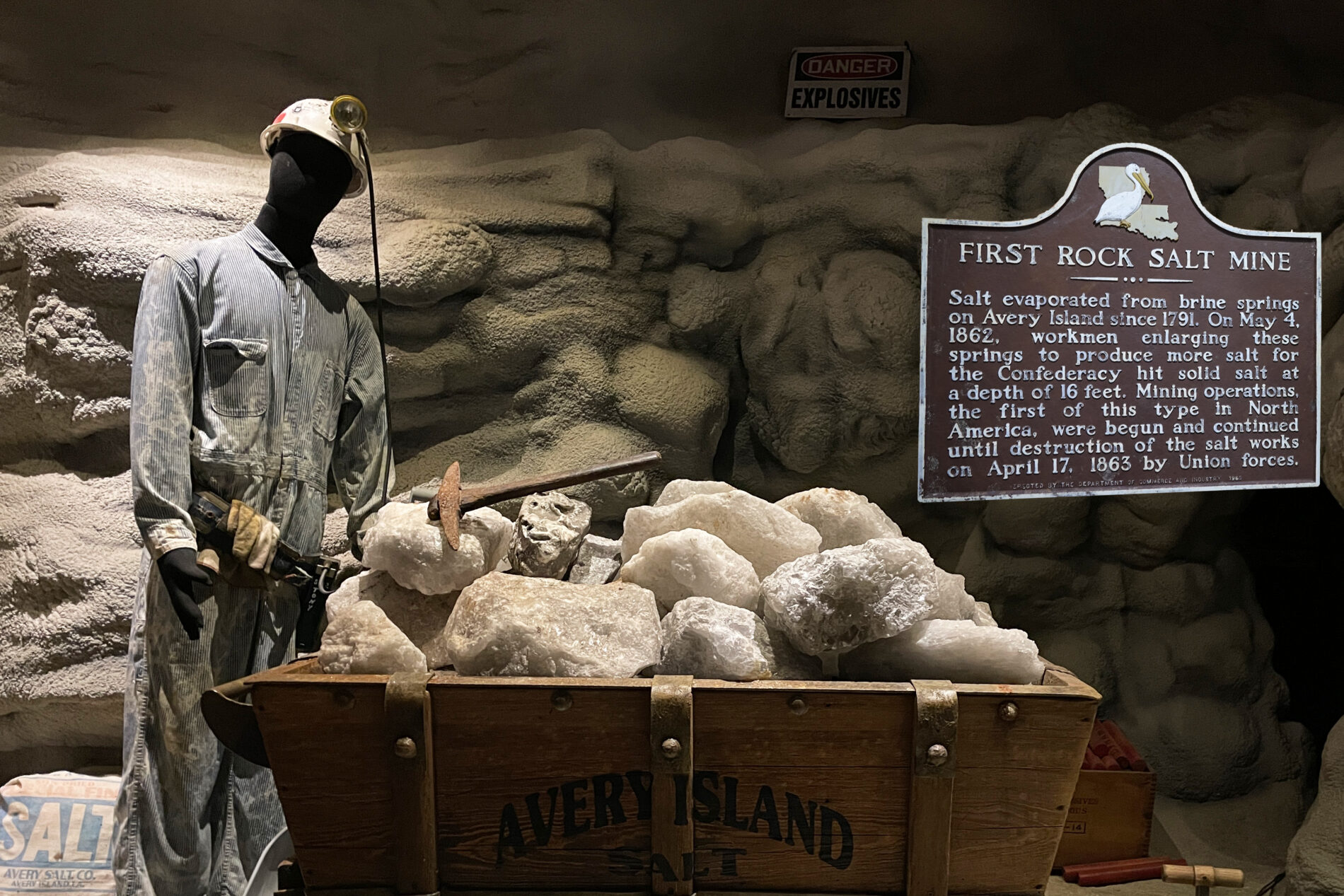 An Avery Island Salt Mine exhibit featuring a mine tunnel and a workman with a wagon full of huge chunks of salt.