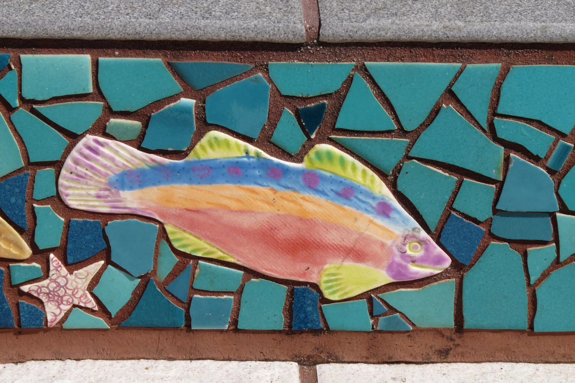 A rainbow trout among the whimsical creatures on the mosaic stairs in San Francisco.