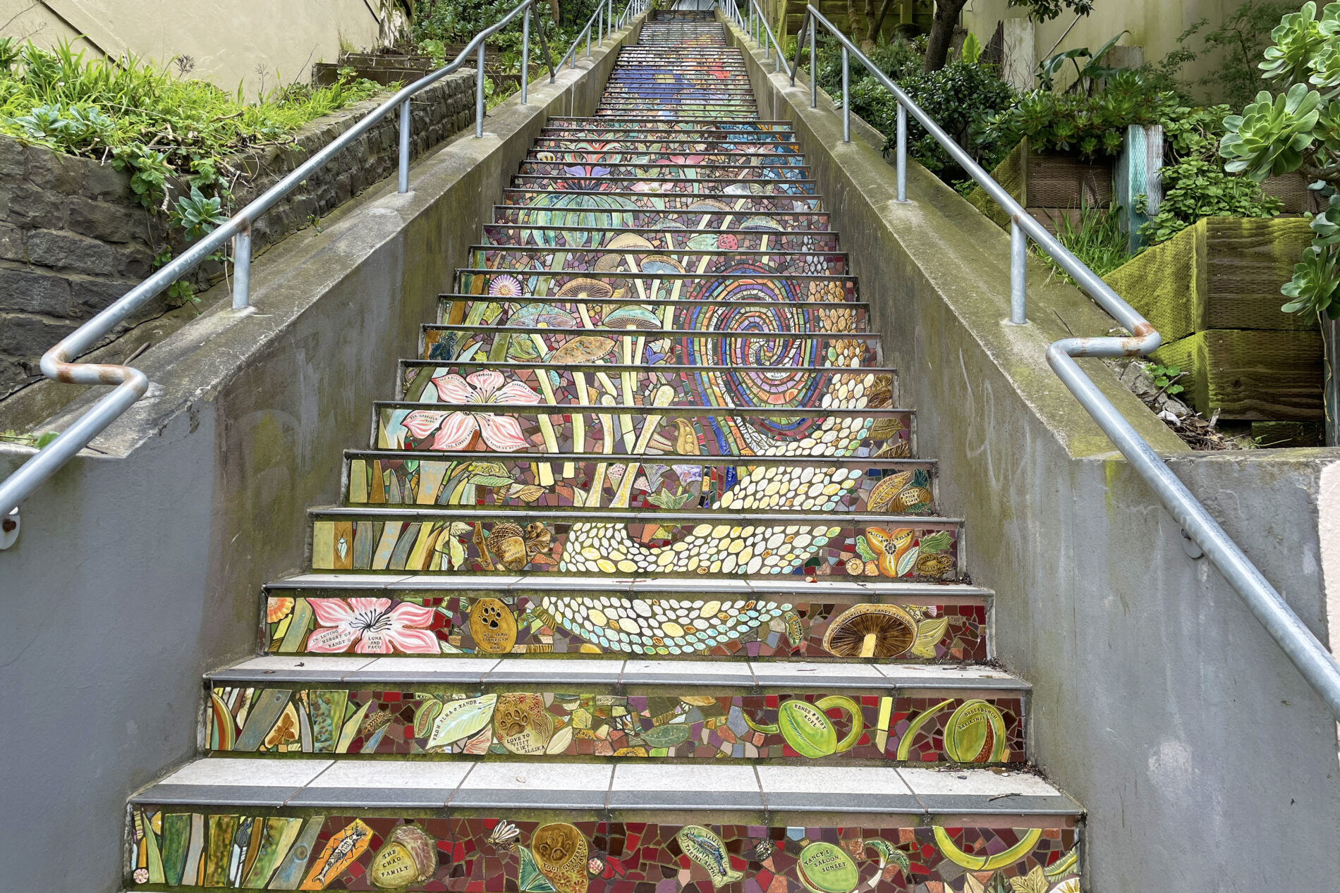A giant snail and wild mushrooms in the mosaic mural on the Hidden Garden Steps in San Francisco.