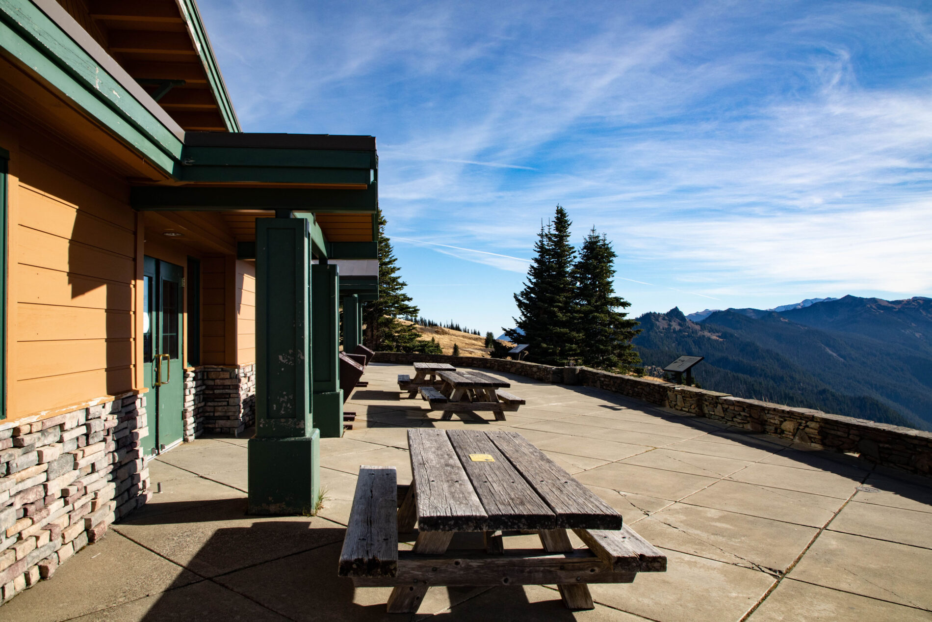 Picnic tables with a view of the mountains at Hurricane Ridge visitor center.