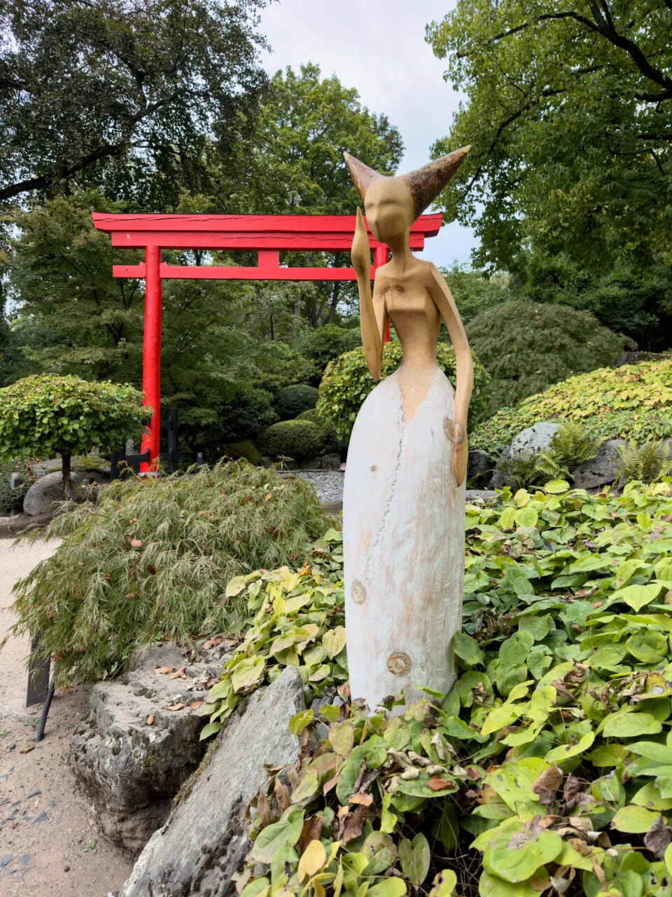 Art sculptures are dotted throughout the Japanischer Garten.